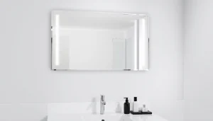 Stylish elegant bathroom mirror with LED lights enhancing a modern bathroom.
